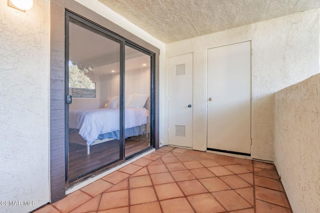 4481 Antigua Way Oxnard, CA 93035 - Photo 39 of 76 a bedroom with a bed and large window
