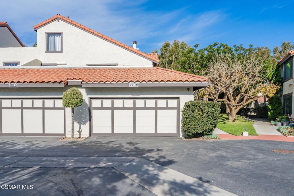 4481 Antigua Way Oxnard, CA 93035 - Photo 46 of 76 a front view of a house with a garden