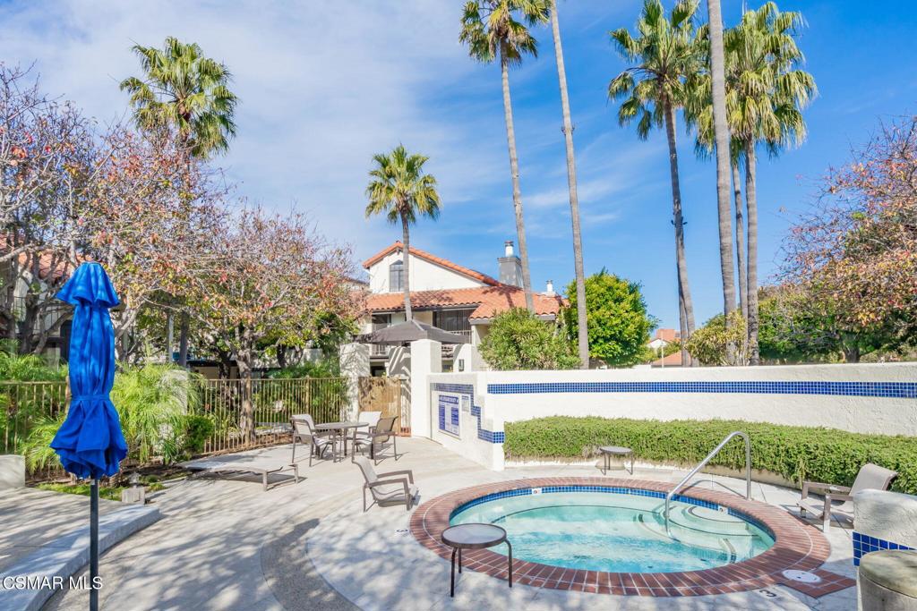 4481 Antigua Way Oxnard, CA 93035 - Photo 50 of 76 a backyard of a house with table and chairs plants