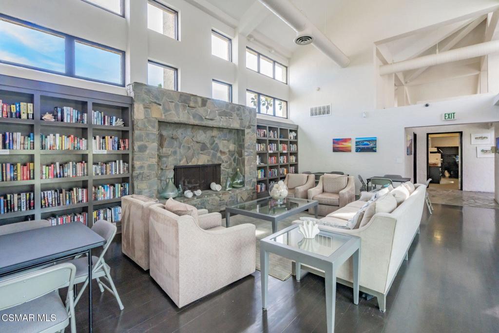 4481 Antigua Way Oxnard, CA 93035 - Photo 59 of 76 a living room with fireplace furniture and a wooden floor