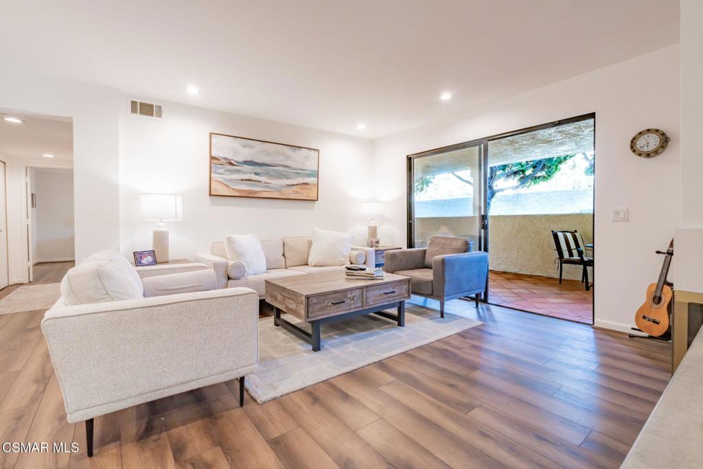 4481 Antigua Way Oxnard, CA 93035 - Photo 7 of 76 a living room with furniture and a wooden floor
