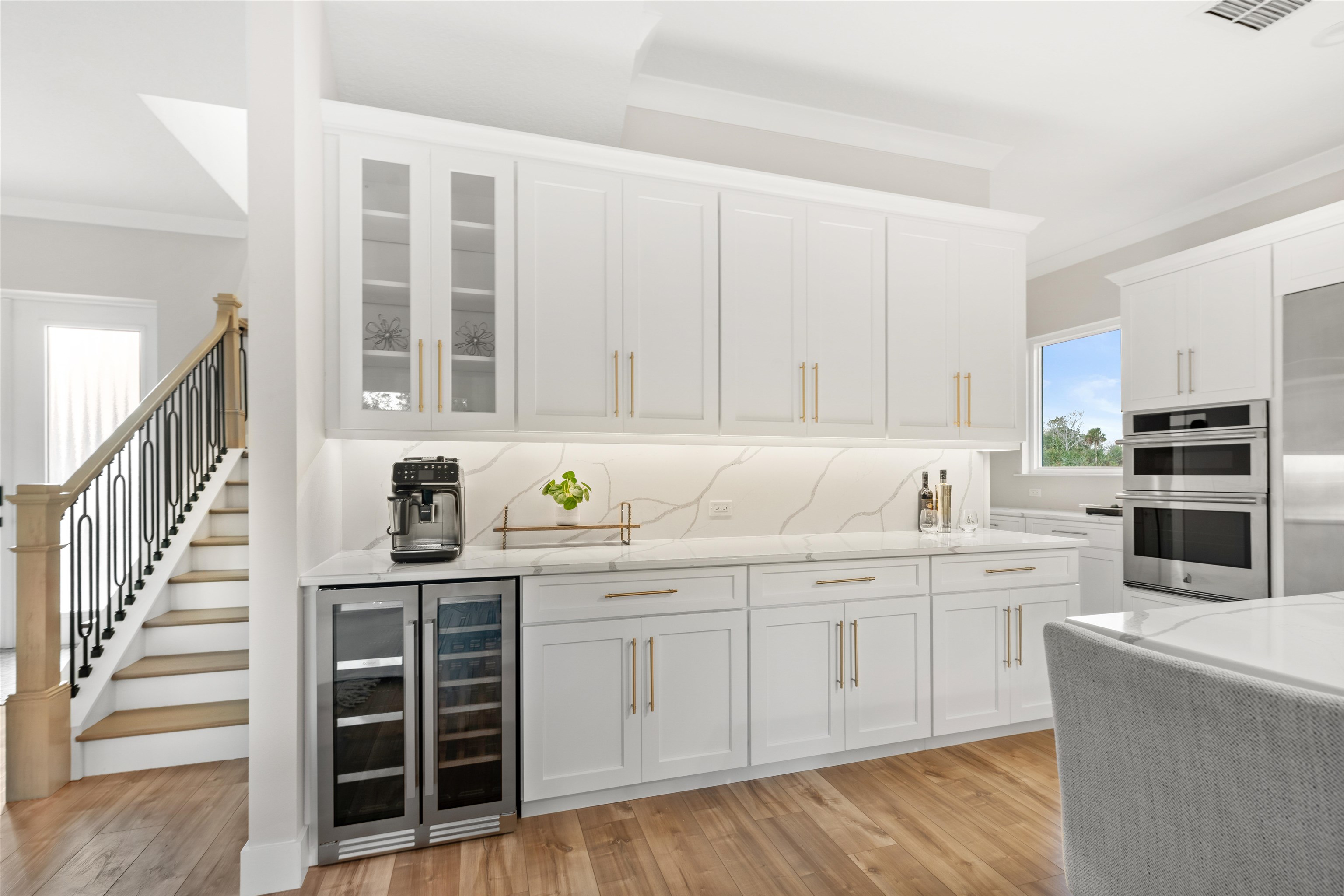 2549 Palm Avenue Flagler Beach, FL 32136 - Photo 12 of 65 a kitchen with stainless steel appliances granite countertop a stove and white cabinets