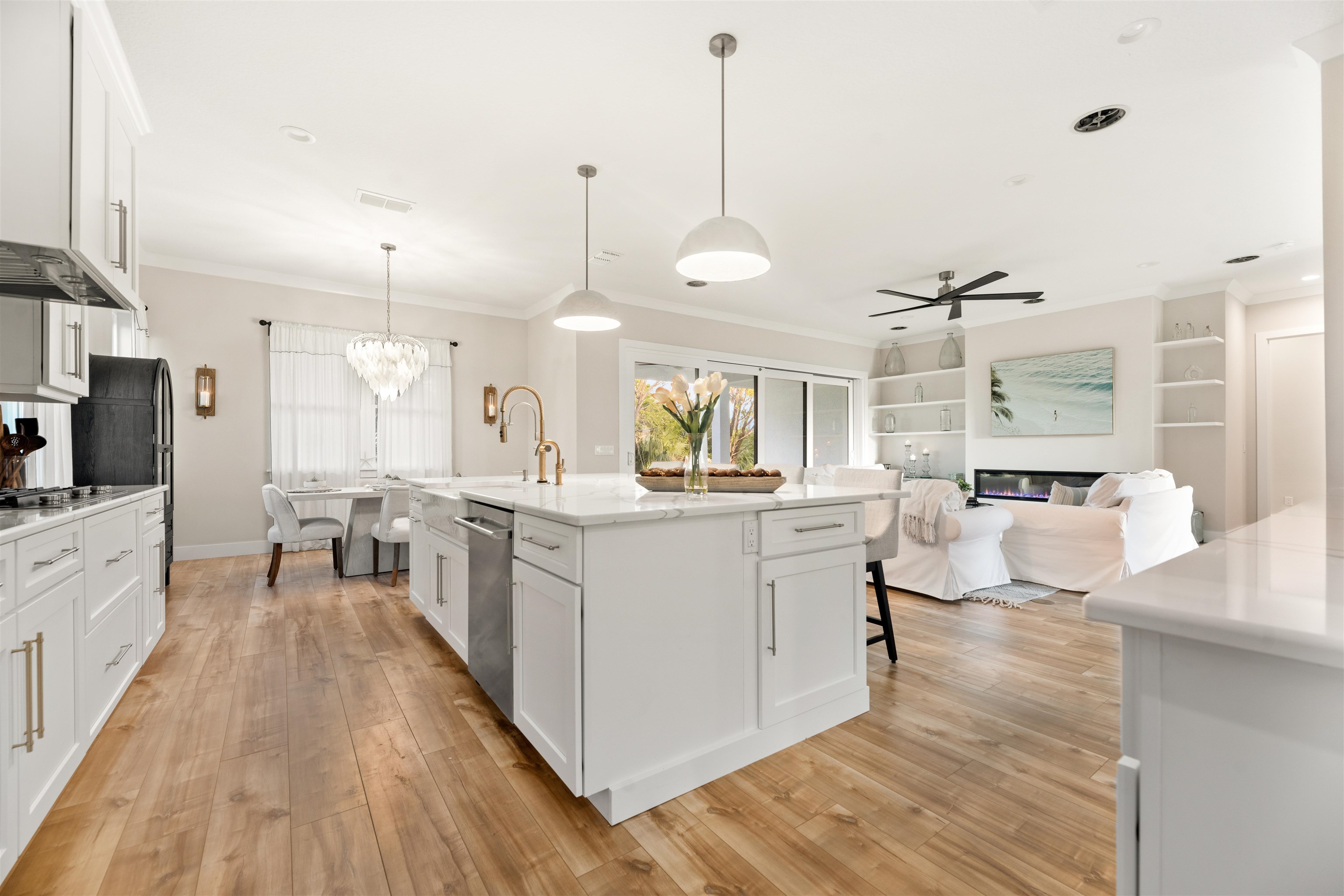 2549 Palm Avenue Flagler Beach, FL 32136 - Photo 17 of 65 a large kitchen with kitchen island a large counter space a sink stainless steel appliances and cabinets