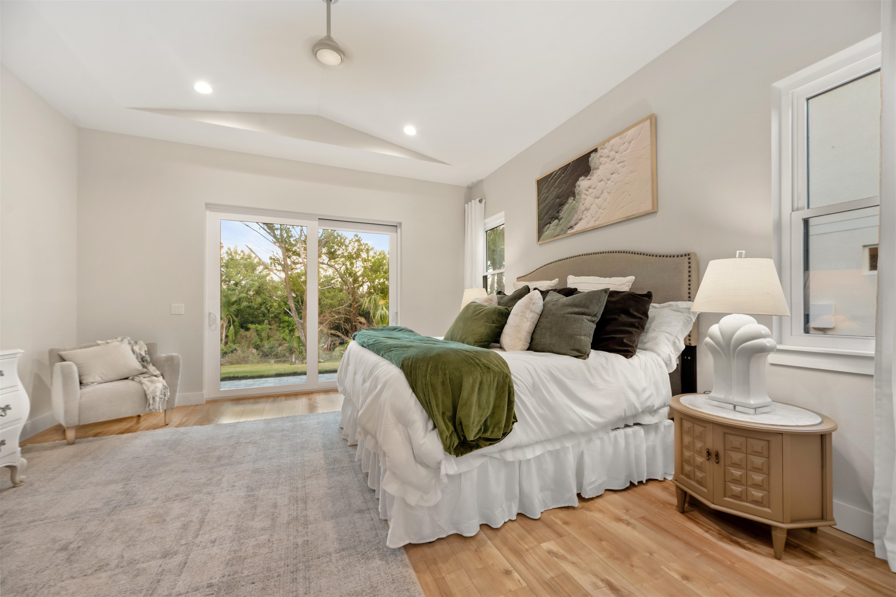 2549 Palm Avenue Flagler Beach, FL 32136 - Photo 21 of 65 Bedroom with access to outside, light wood-type flooring, vaulted ceiling, and recessed lighting