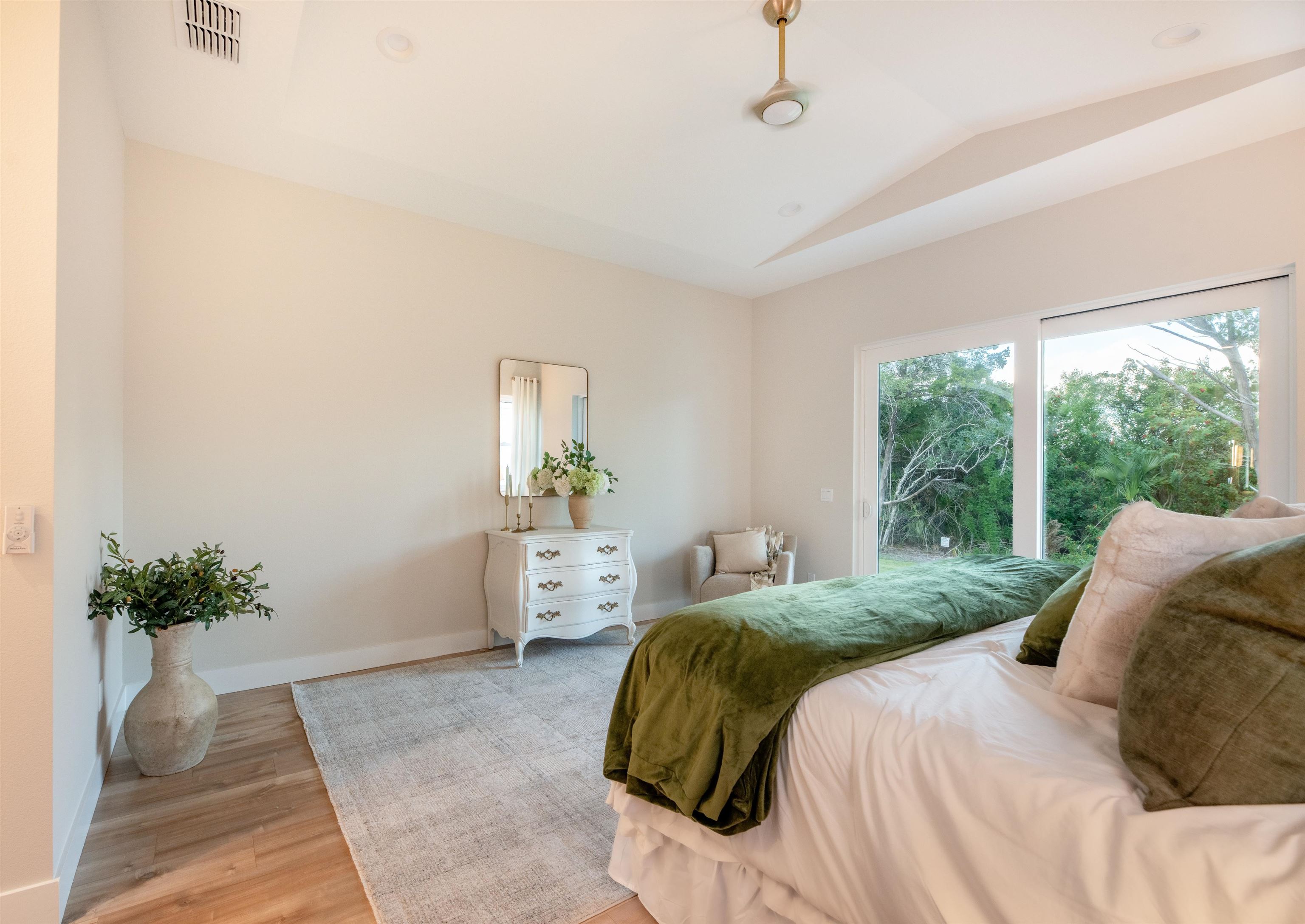 2549 Palm Avenue Flagler Beach, FL 32136 - Photo 22 of 65 a bedroom with a bed and a potted plant