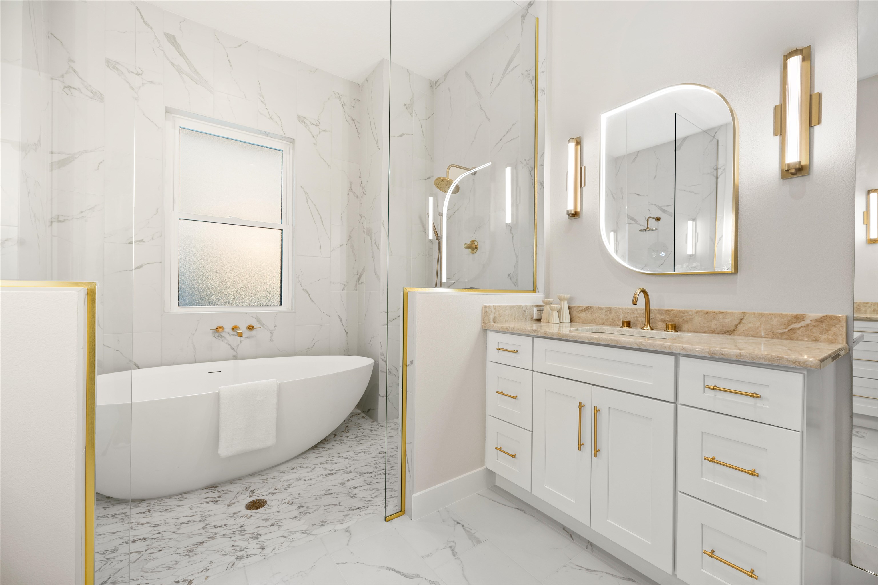 2549 Palm Avenue Flagler Beach, FL 32136 - Photo 24 of 70 a spacious bathroom with a double vanity sink mirror and bathtub