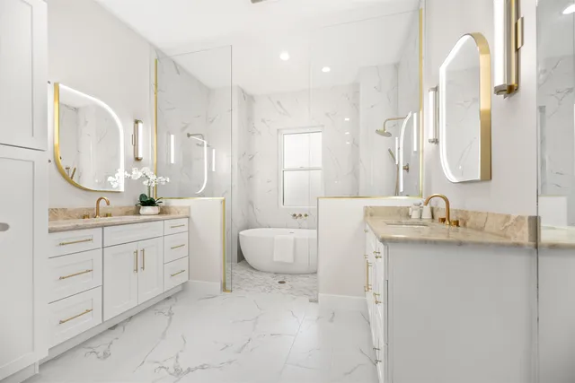 a bathroom with a toilet a sink and mirror