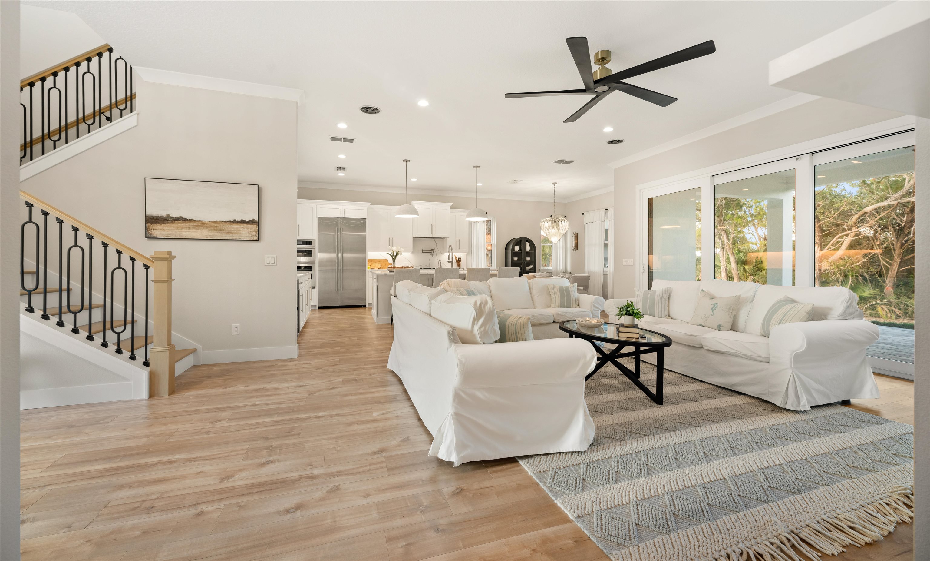 2549 Palm Avenue Flagler Beach, FL 32136 - Photo 3 of 65 a living room with furniture and a view of kitchen