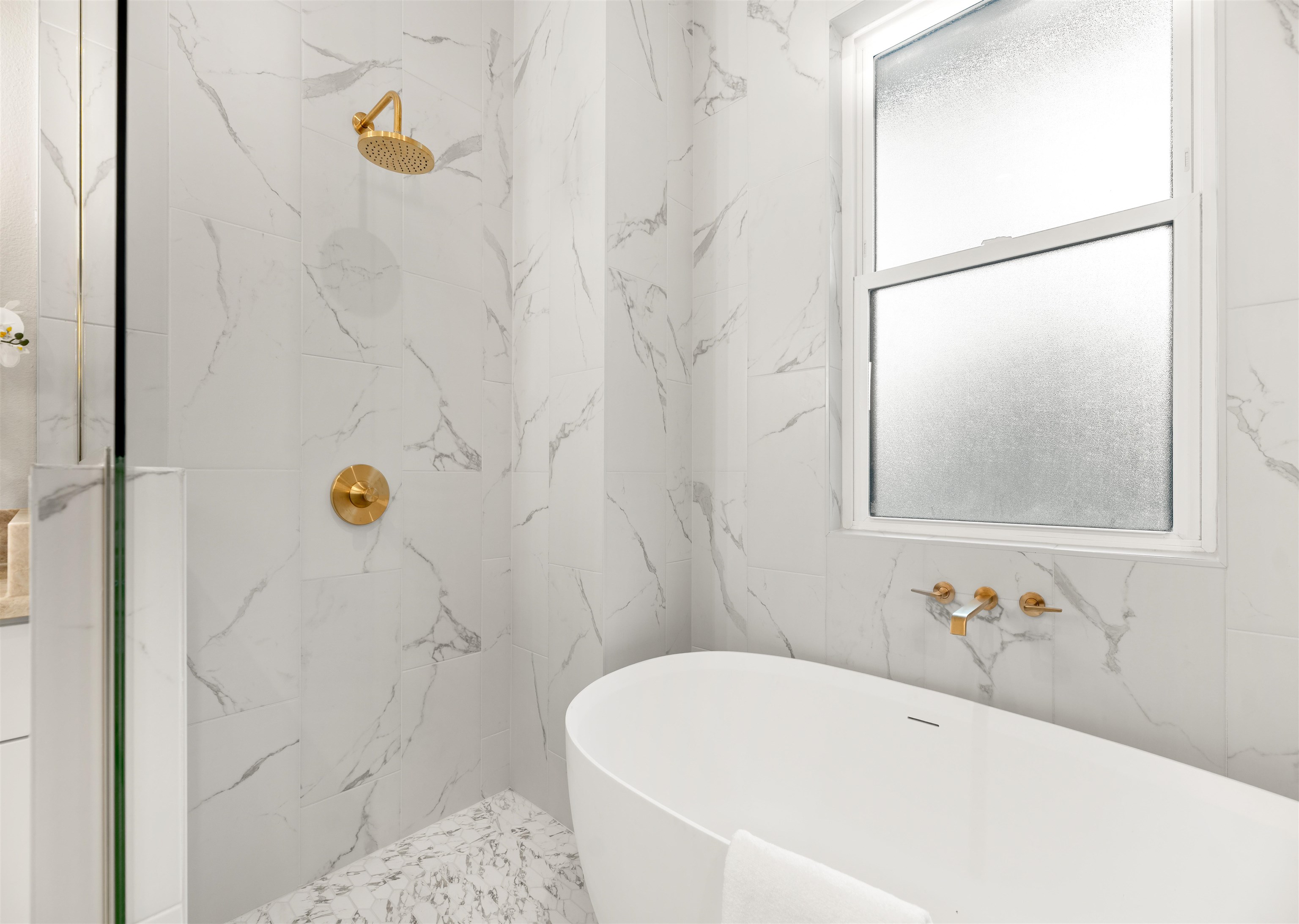 2549 Palm Avenue Flagler Beach, FL 32136 - Photo 33 of 65 a bathroom with a tub and a shower