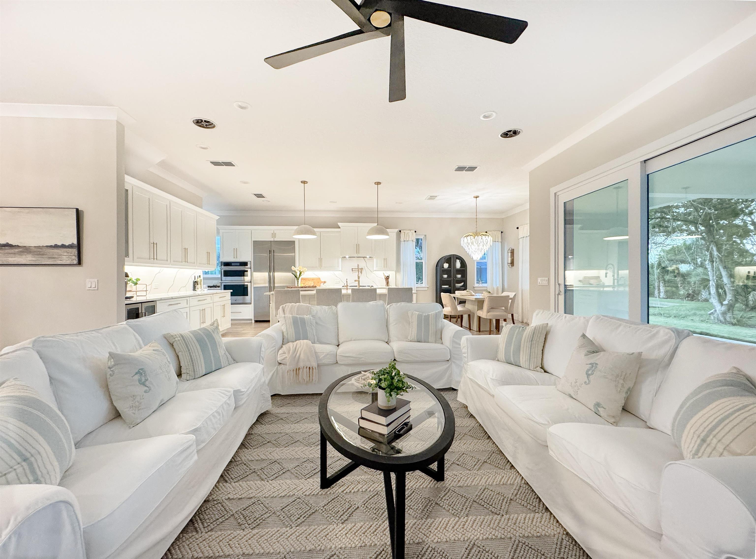 2549 Palm Avenue Flagler Beach, FL 32136 - Photo 4 of 65 a living room with furniture and a large window