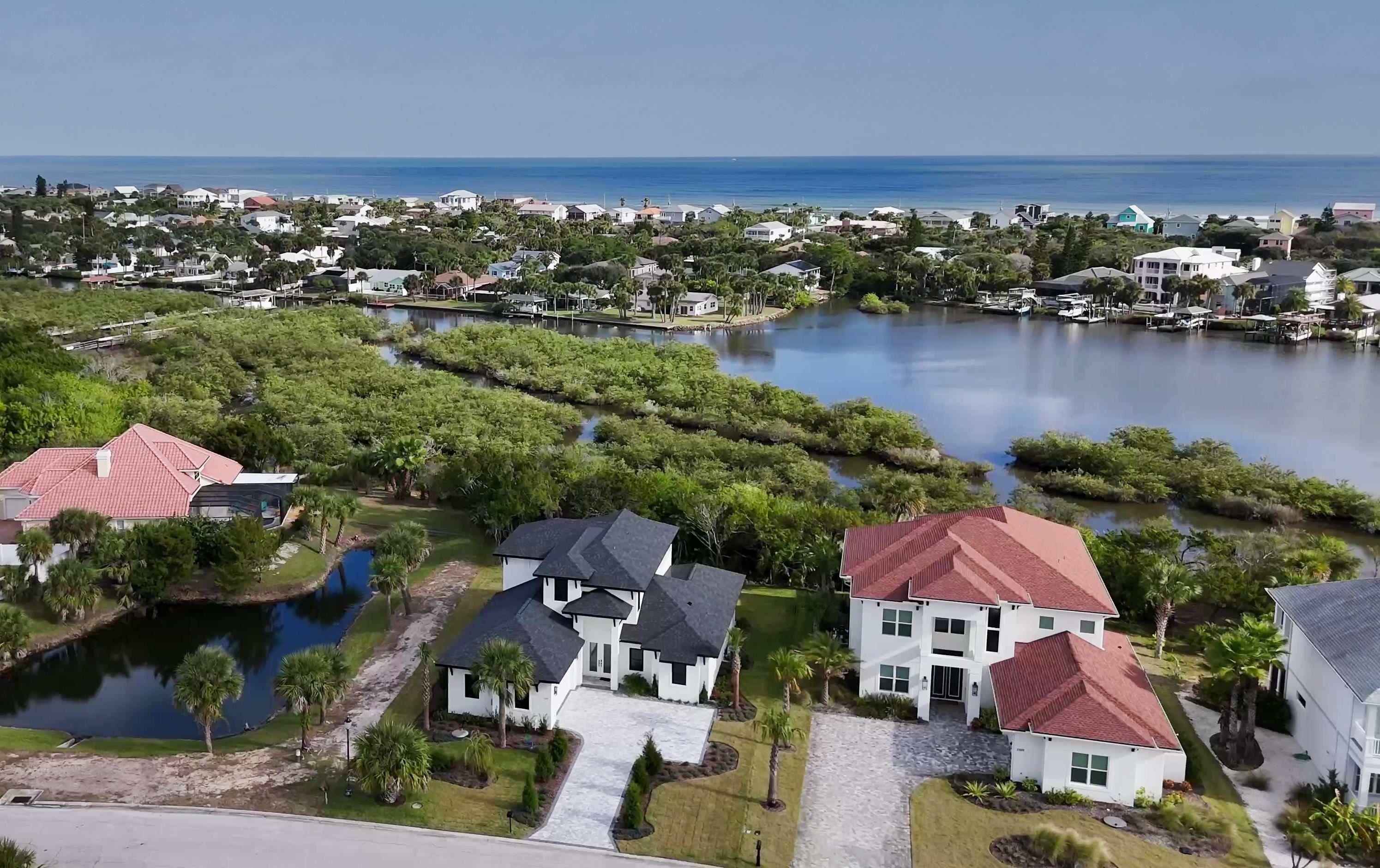 2549 Palm Avenue Flagler Beach, FL 32136 - Photo 42 of 70 an aerial view of residential houses with outdoor space and river