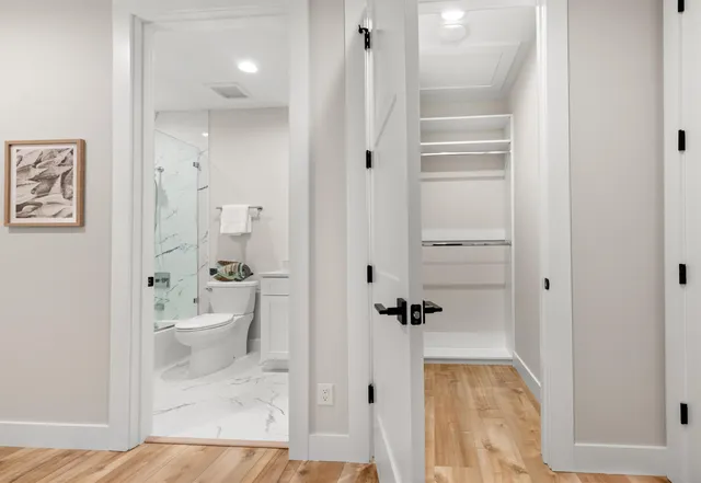 a view of a hallway with windows