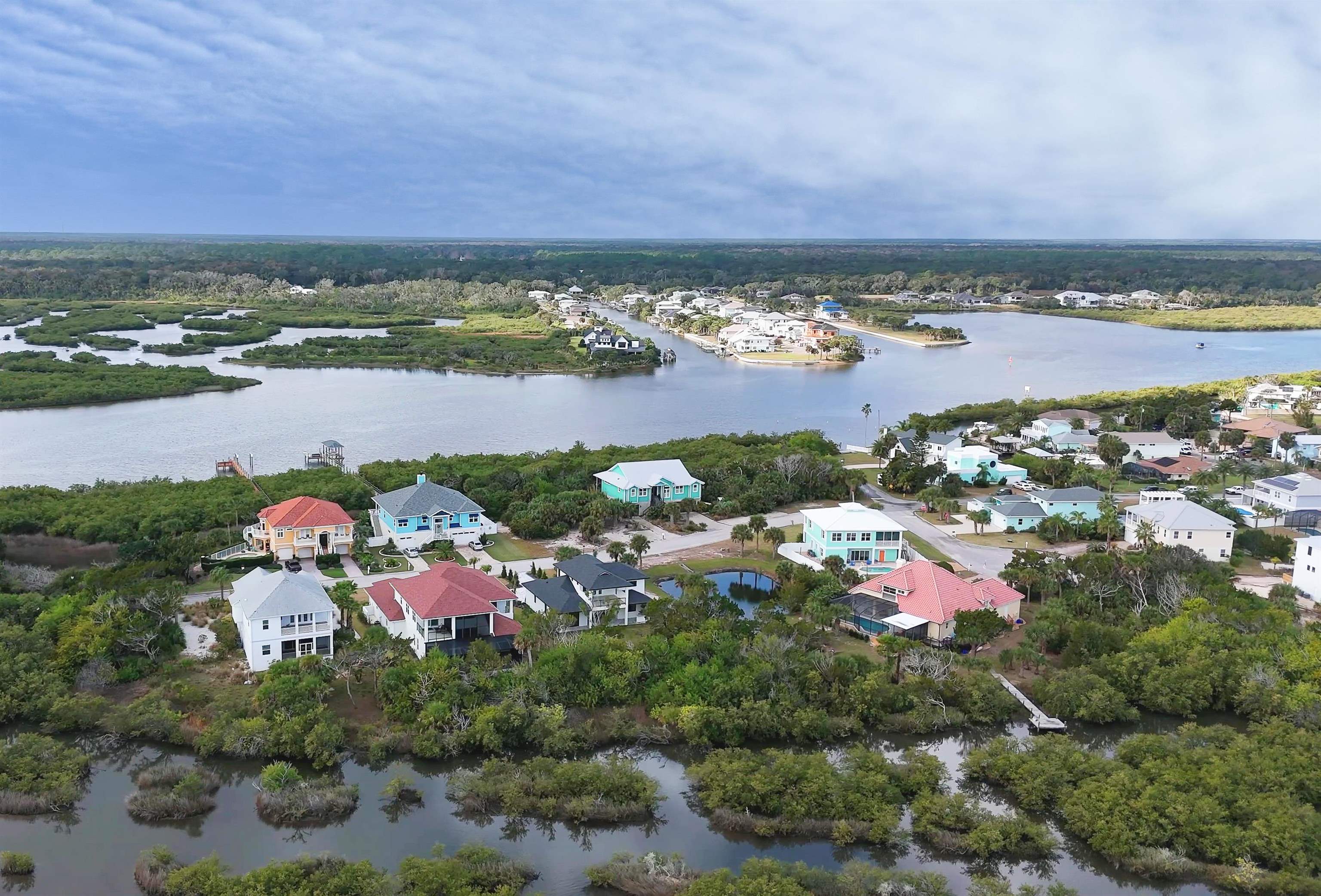 2549 Palm Avenue Flagler Beach, FL 32136 - Photo 45 of 70 an aerial view of a city with lots of residential buildings ocean and mountain view in back