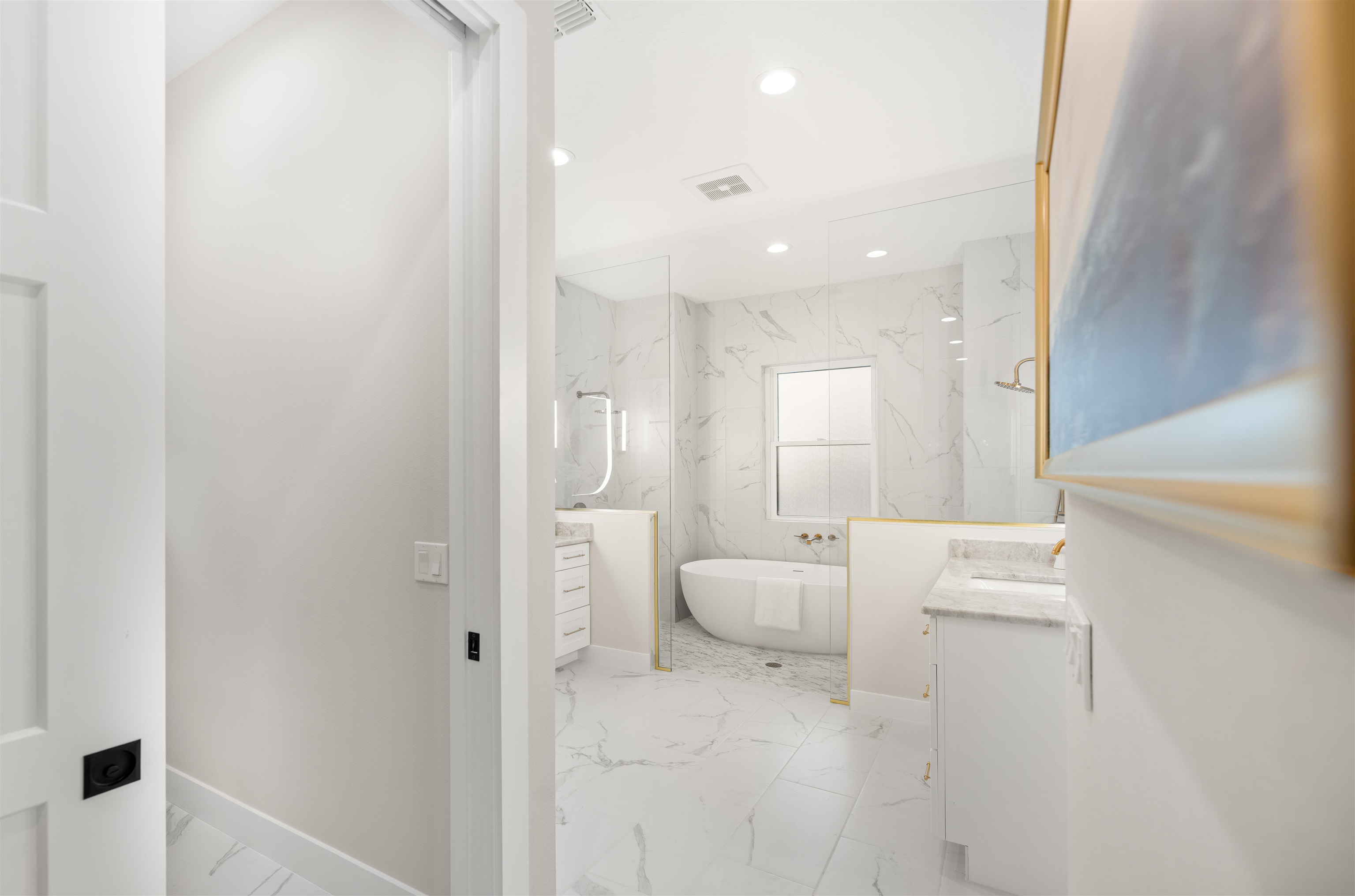 2549 Palm Avenue Flagler Beach, FL 32136 - Photo 52 of 70 Full bathroom featuring vanity, light marble finish floors, a freestanding tub, a marble finish shower, and recessed lighting