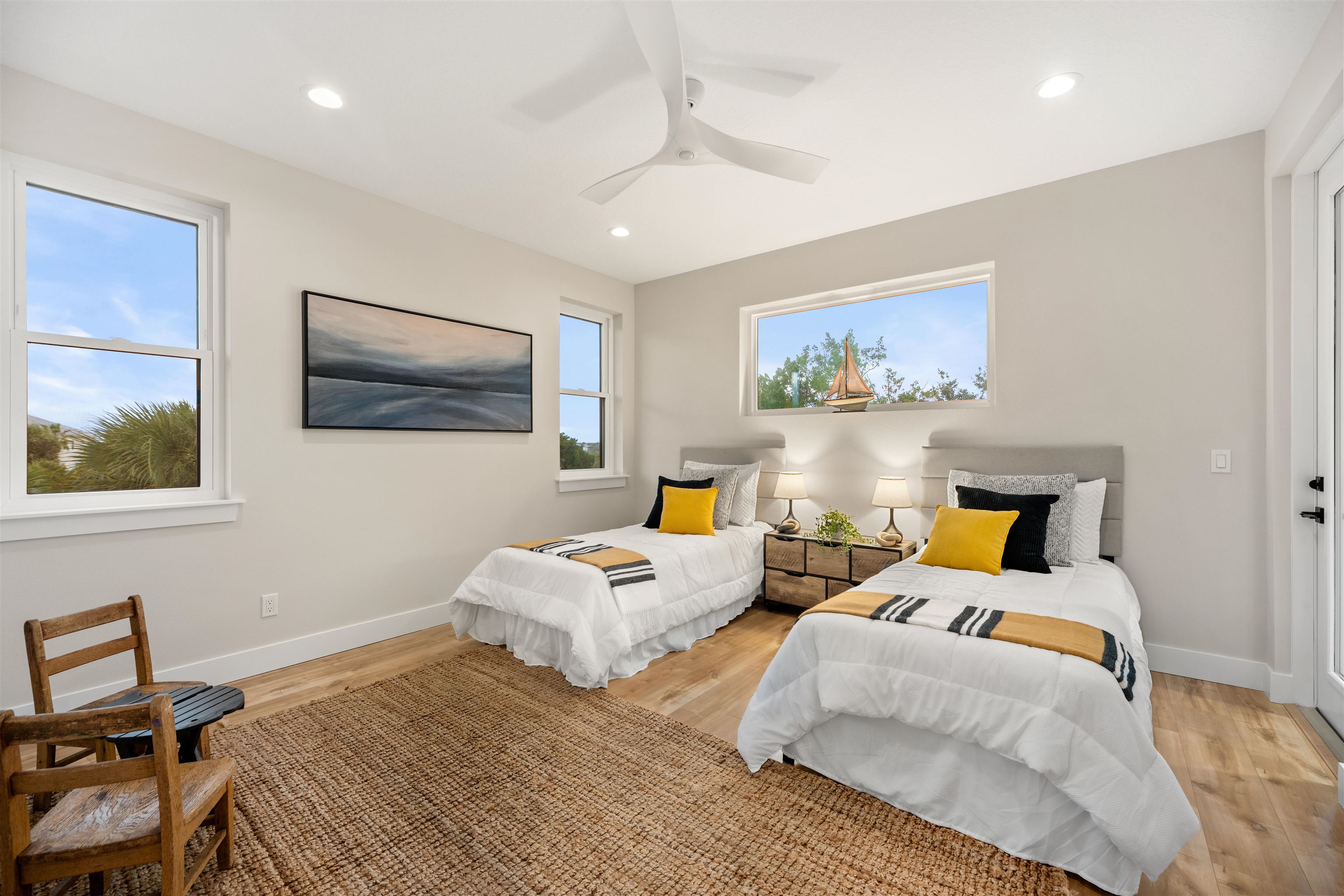 2549 Palm Avenue Flagler Beach, FL 32136 - Photo 52 of 65 a bedroom with two beds and painting on the wall