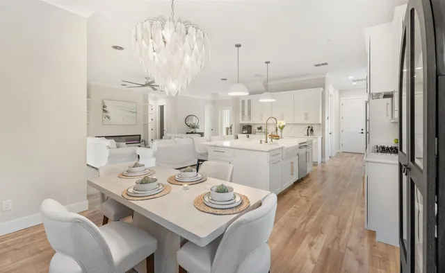 a kitchen with white cabinets and appliances
