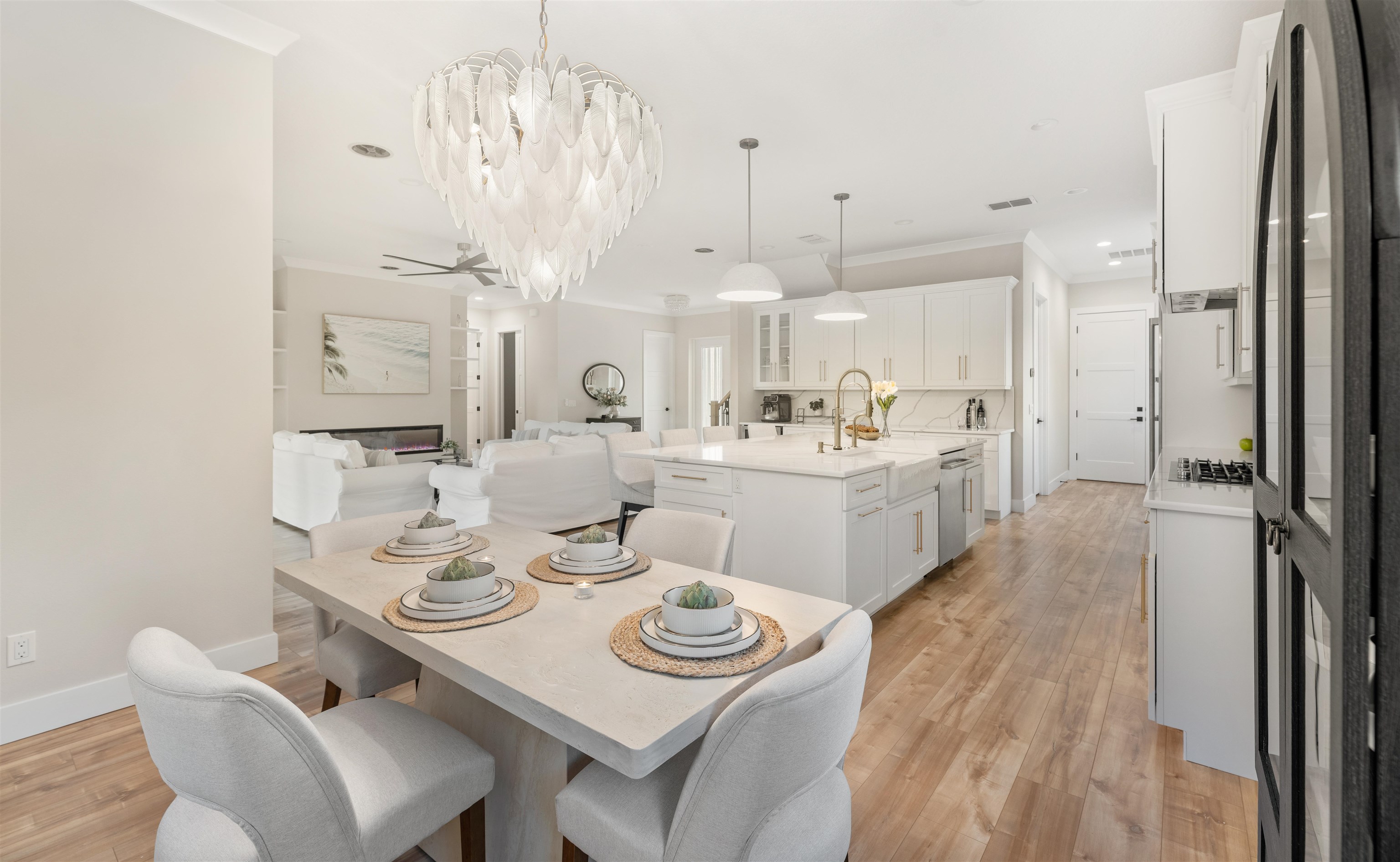 2549 Palm Avenue Flagler Beach, FL 32136 - Photo 8 of 65 a view of a dining room with furniture a chandelier and wooden floor