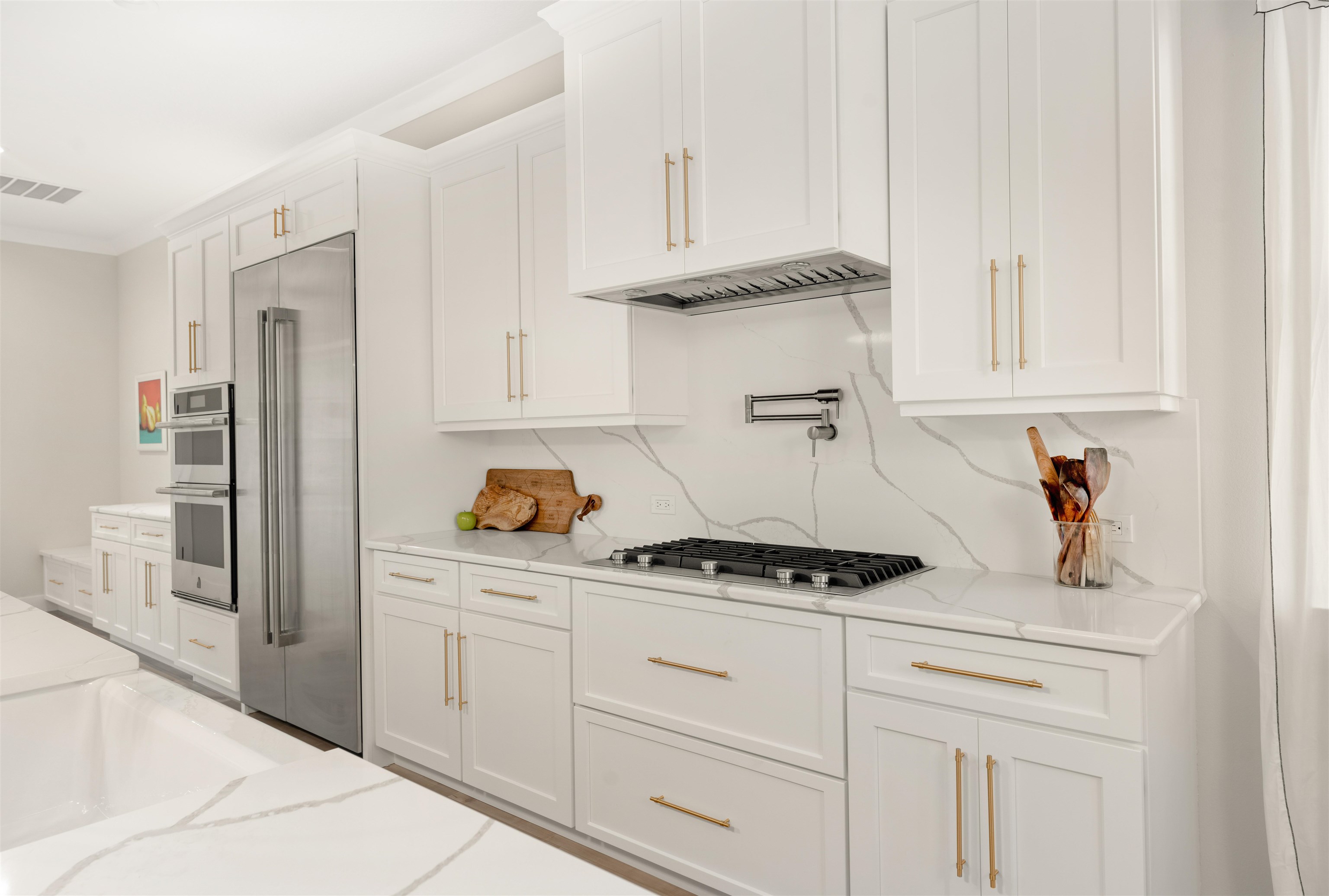 2549 Palm Avenue Flagler Beach, FL 32136 - Photo 9 of 65 a kitchen with white cabinets and appliances