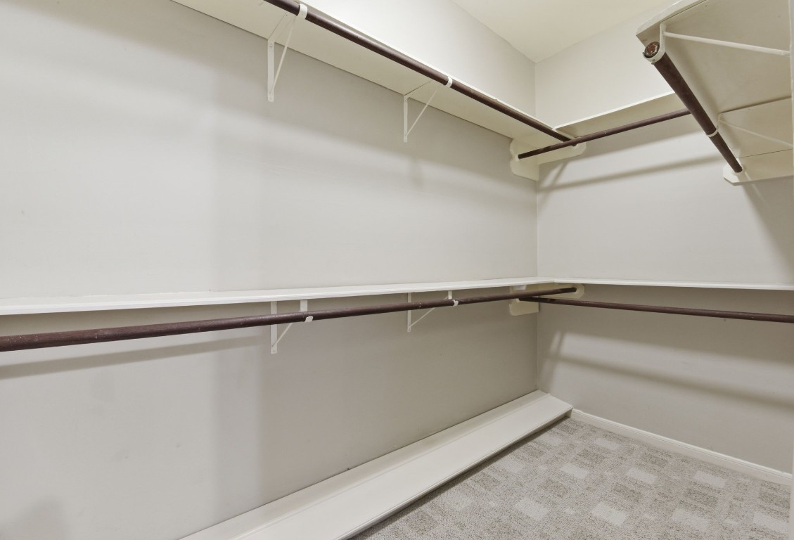 727 Bunker Hill Road, Unit 34 Houston, TX 77024 - Photo 32 of 50 Spacious walk-in closet in primary bedroom with built-in shelving and ample storage