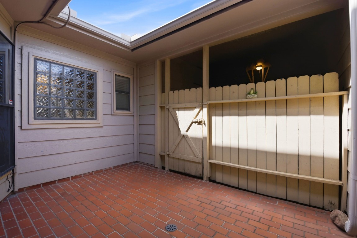 727 Bunker Hill Road, Unit 34 Houston, TX 77024 - Photo 44 of 50 Charming deck with brick flooring — perfect for outdoor relaxing