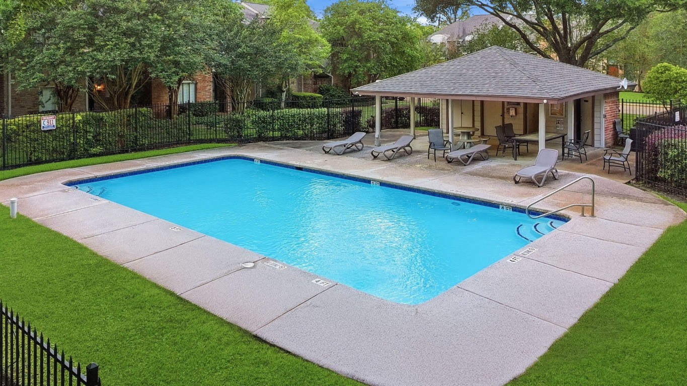 727 Bunker Hill Road, Unit 34 Houston, TX 77024 - Photo 49 of 50 Community pool featuring a covered pavilion for shade and relaxation.