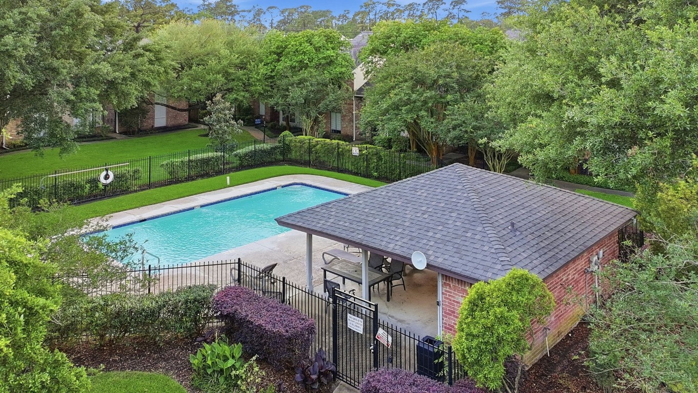 727 Bunker Hill Road, Unit 34 Houston, TX 77024 - Photo 50 of 50 Aerial view of the beautifully maintained community pool and grounds