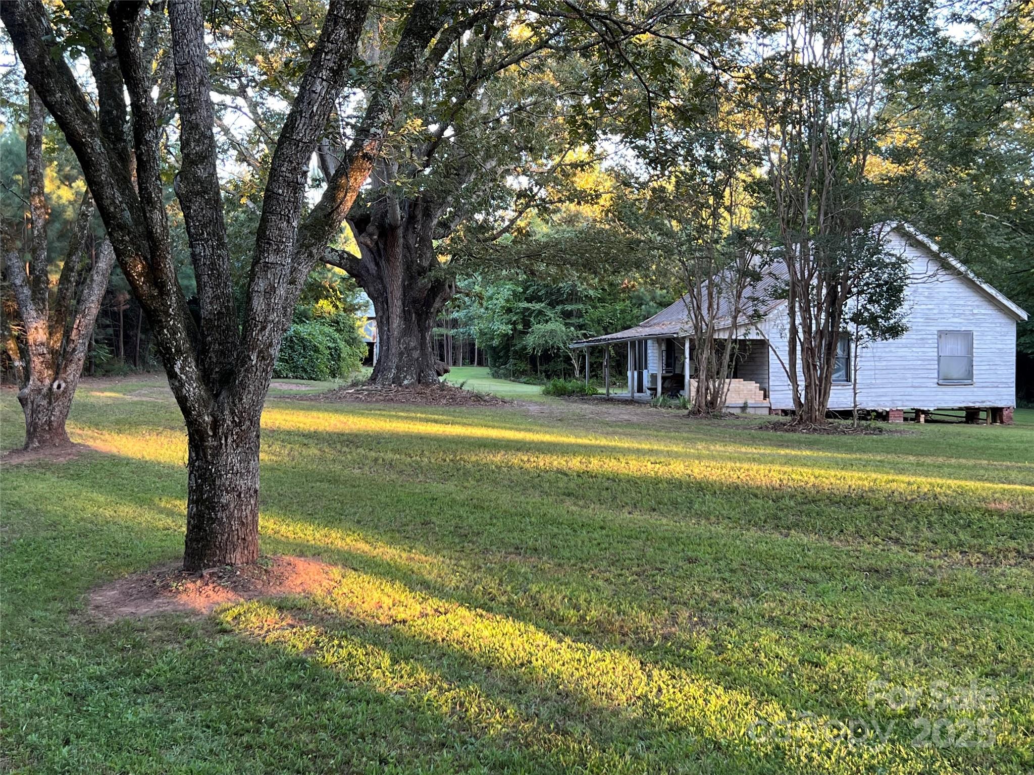 8277 Lockhart Road Sharon, SC 29742 - Photo 3 of 48 a view of a house with a yard