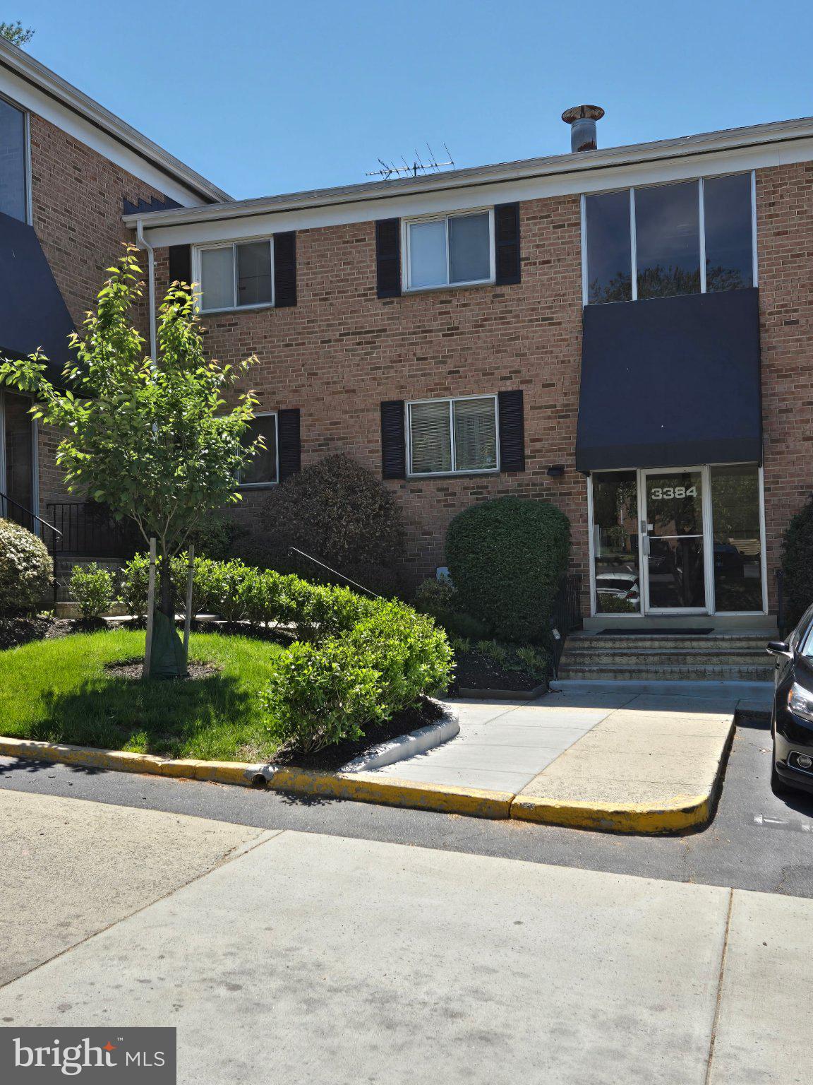 a view of a house with a yard and plants