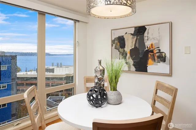 a dining room with furniture and a window