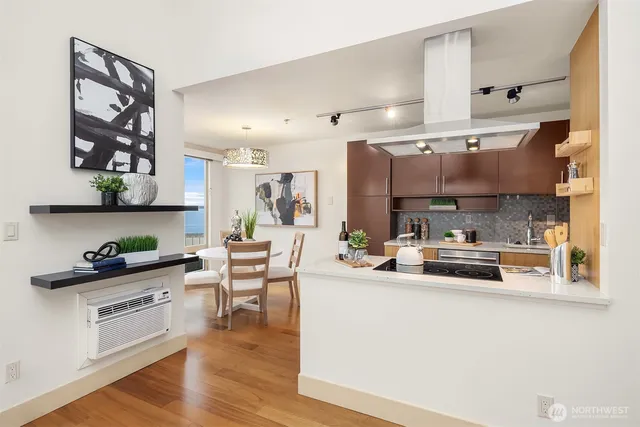 a kitchen with a sink a stove and cabinets