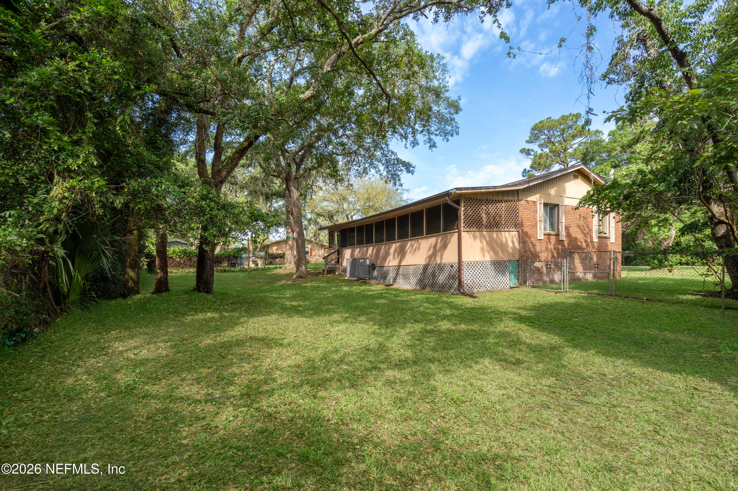 253 Cowry Road St. Augustine, FL 32086 - Photo 25 of 27 a view of a house with a backyard