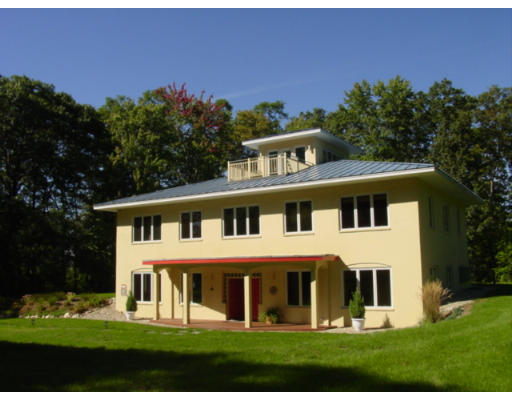 203 Maple Ridge Road Northampton, MA 01062 - Photo 1 of 6 a front view of a house with a yard