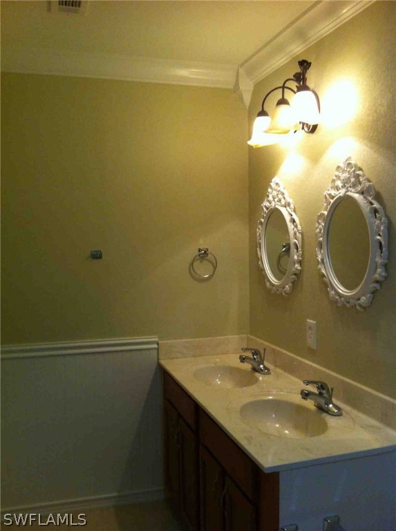 17 Iowa Road Lehigh Acres, FL 33936 - Photo 13 of 18 a bathroom with a sink and a mirror