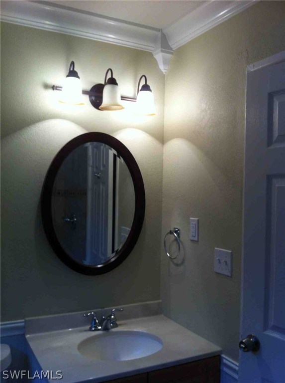 17 Iowa Road Lehigh Acres, FL 33936 - Photo 15 of 18 a bathroom with a sink and a mirror