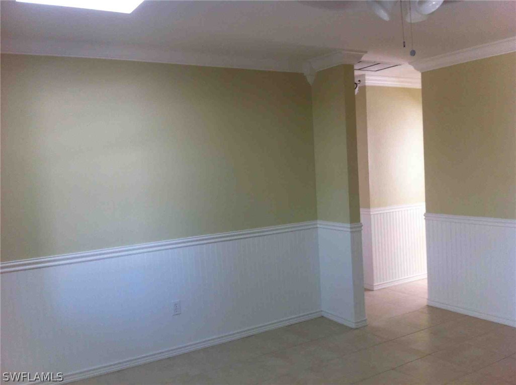 17 Iowa Road Lehigh Acres, FL 33936 - Photo 7 of 18 an empty room with a window