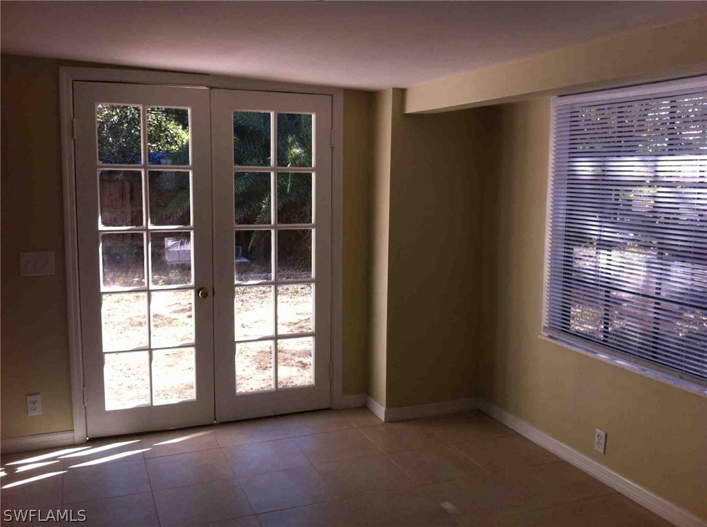 17 Iowa Road Lehigh Acres, FL 33936 - Photo 10 of 18 a view of an empty room with a window