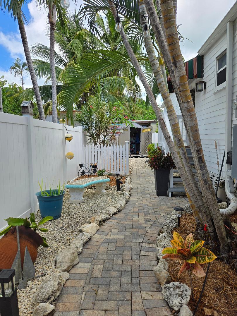 331 Ave F Key West, FL 33040 - Photo 16 of 18 West side walkway and gardens