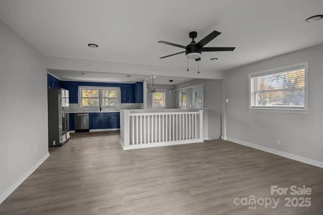 a kitchen with granite countertop a stove and a microwave