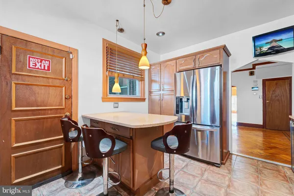a kitchen with stainless steel appliances a stove refrigerator sink and microwave
