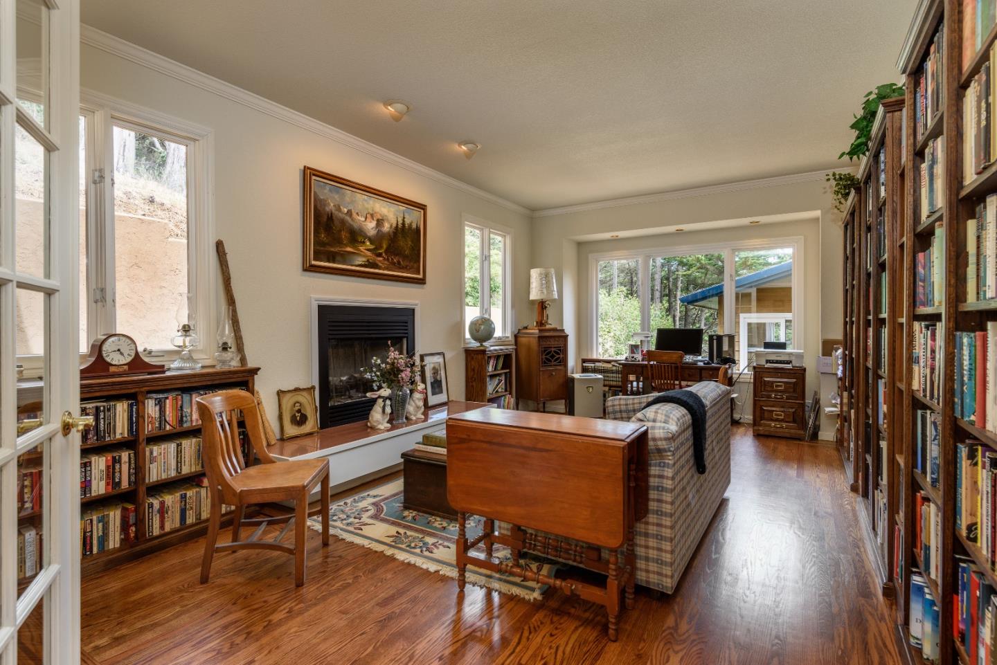 364 Genevieve Avenue Pacifica, CA 94044 - Photo 11 of 24 a living room with furniture a fireplace and a floor to ceiling window