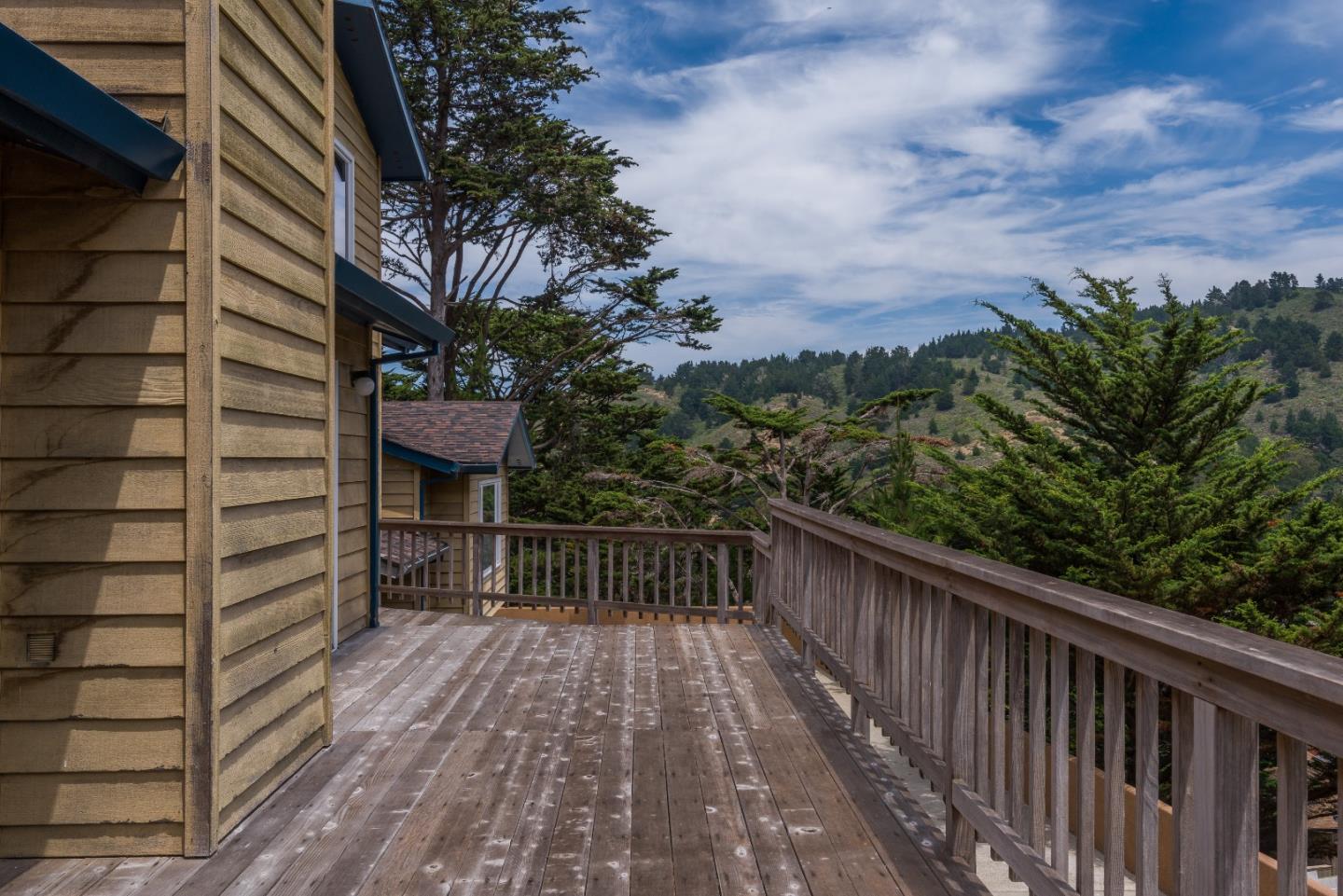 364 Genevieve Avenue Pacifica, CA 94044 - Photo 20 of 24 a view of balcony with wooden floor and fence and trees
