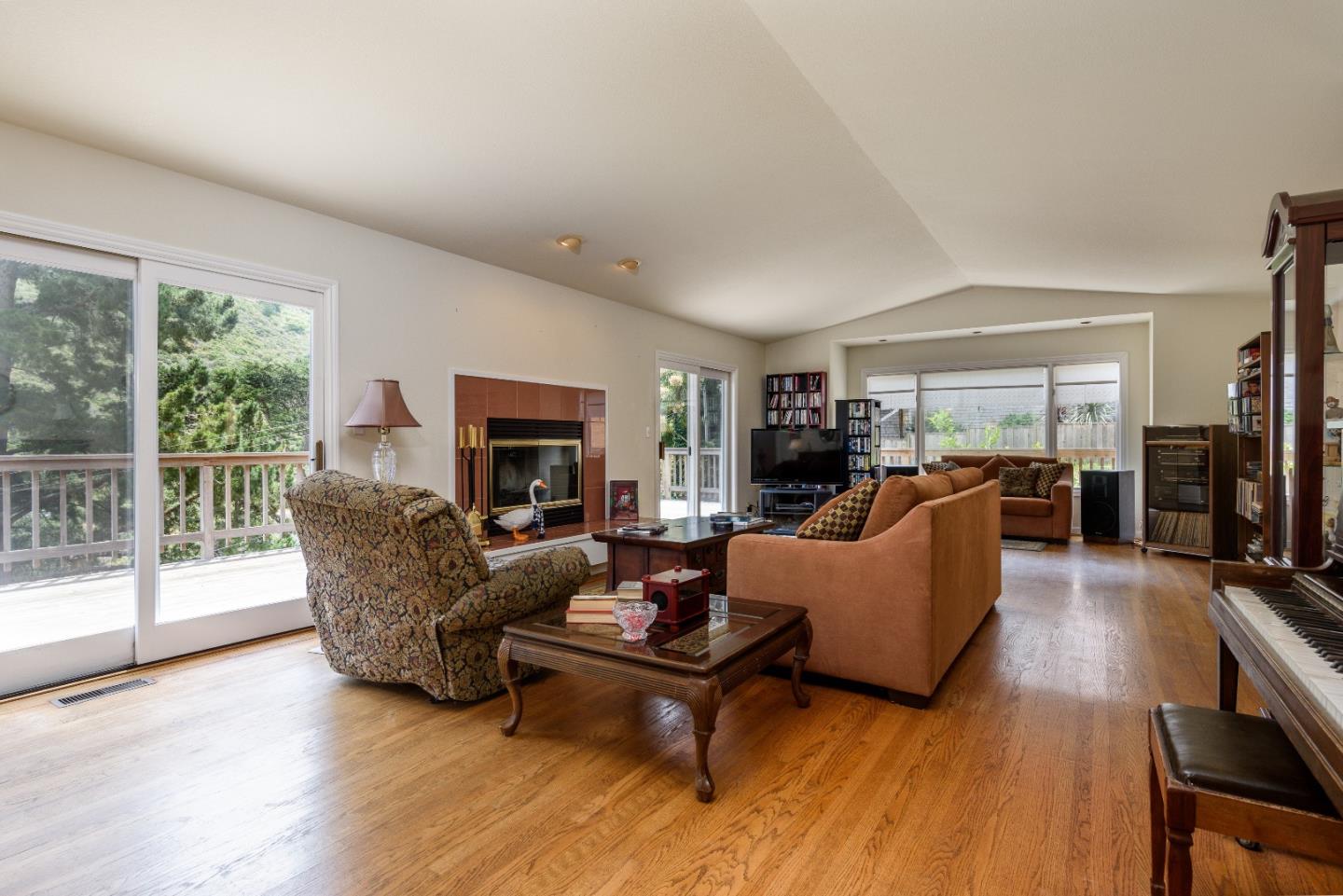 364 Genevieve Avenue Pacifica, CA 94044 - Photo 3 of 24 a living room with furniture and a fireplace