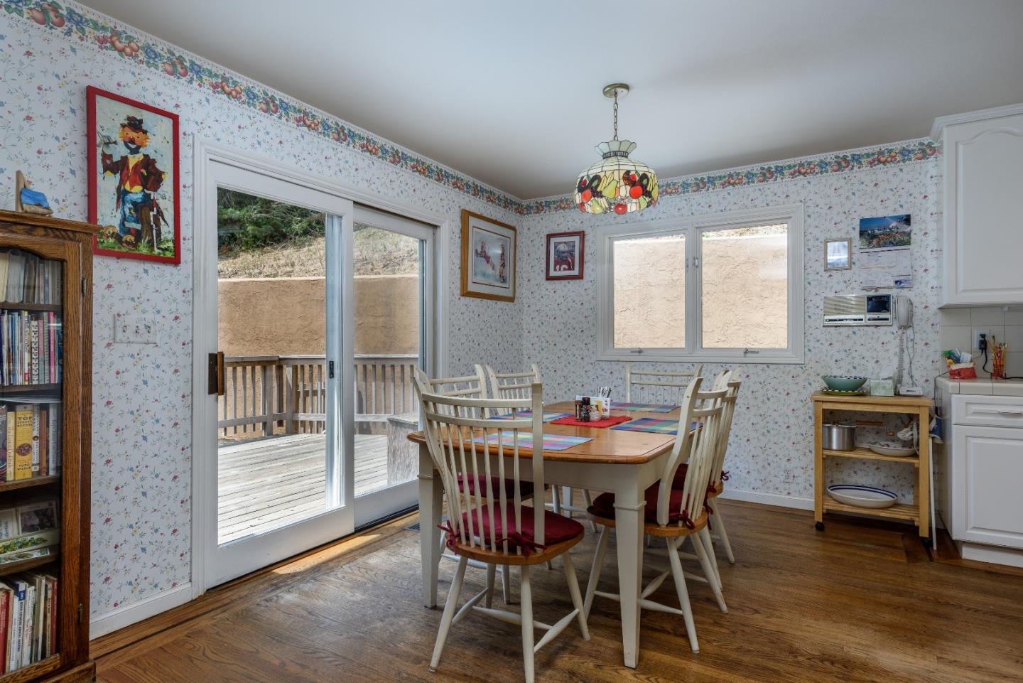 364 Genevieve Avenue Pacifica, CA 94044 - Photo 9 of 24 a view of a dining room with furniture window and wooden floor