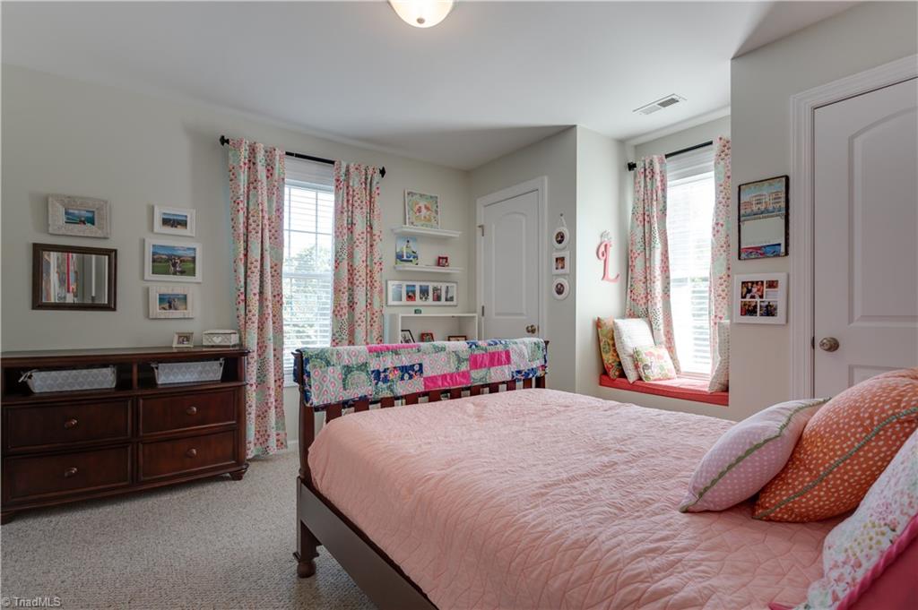 4506 Charlottesville Road Greensboro, NC 27410 - Photo 22 of 30 4th bedroom w/ 2 closets and window seat.
