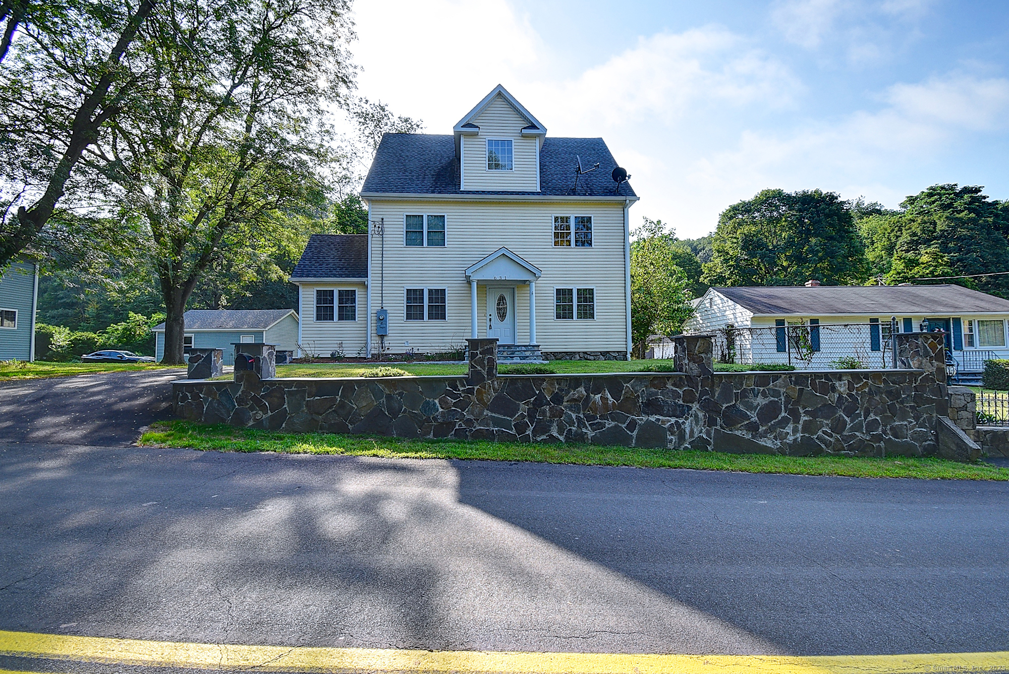 a front view of a house with a yard