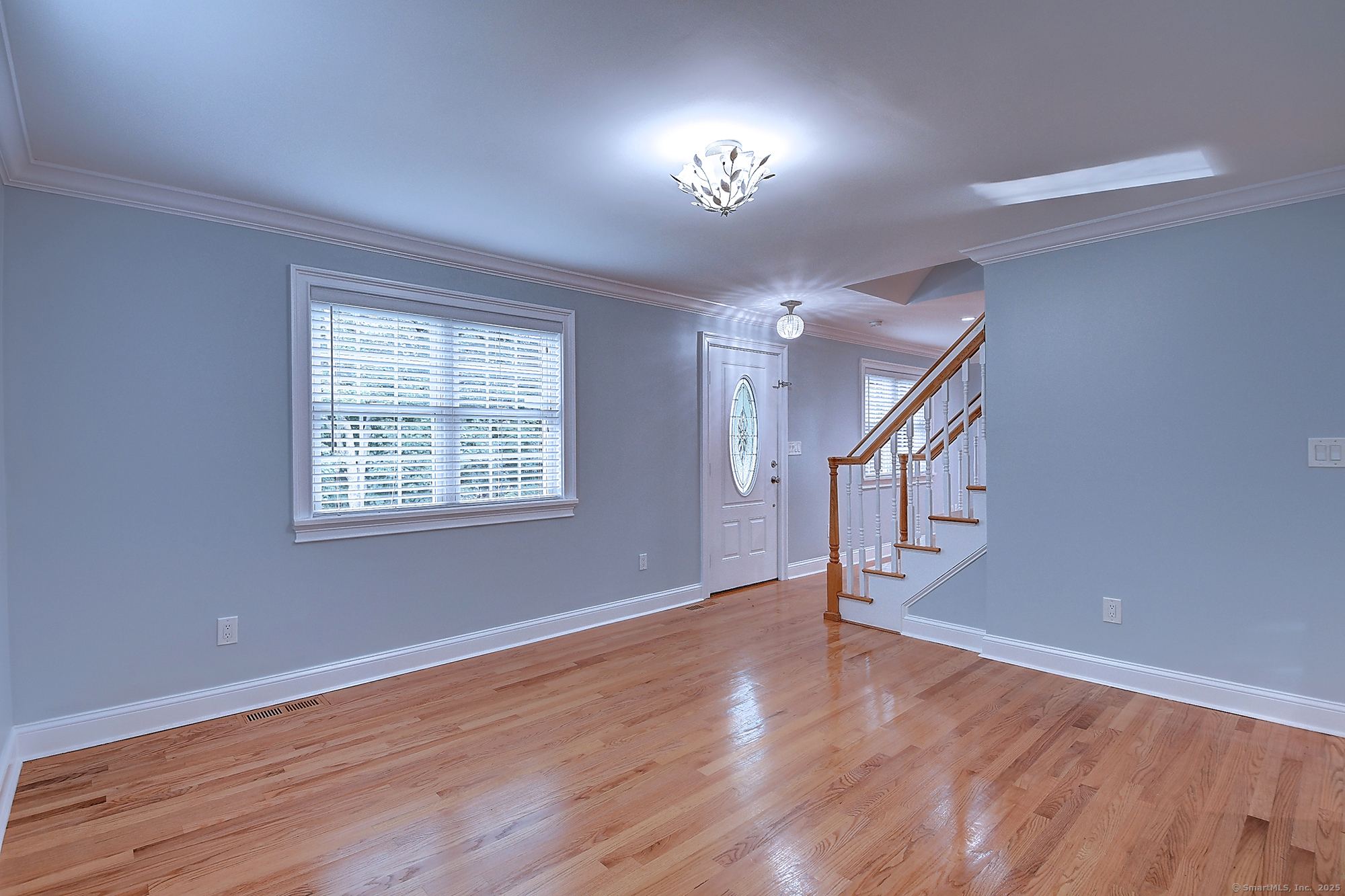 631 High Street Naugatuck, CT 06770 - Photo 17 of 36 a view of an empty room with wooden floor and a window