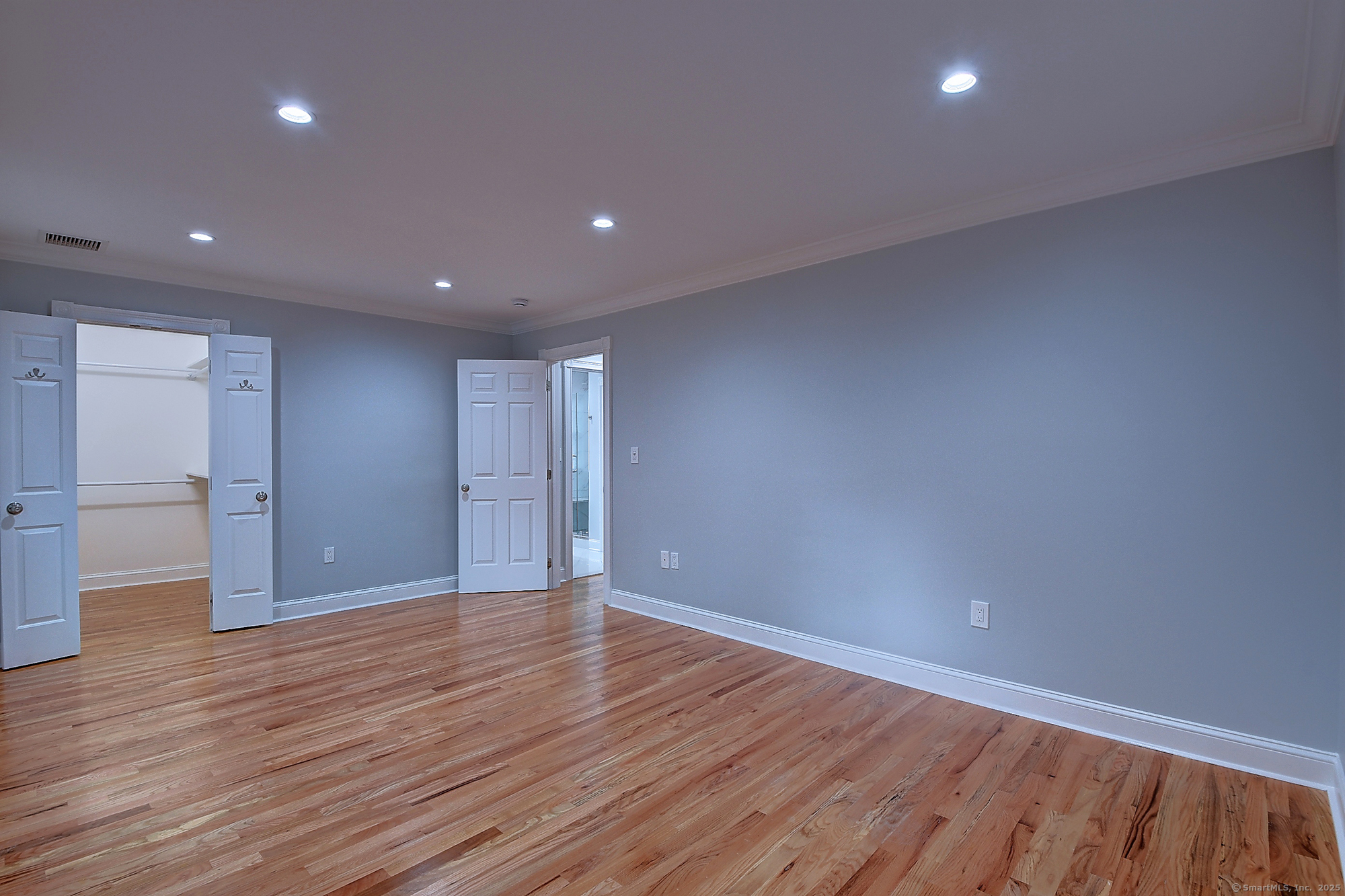 631 High Street Naugatuck, CT 06770 - Photo 21 of 36 a view of an empty room with wooden floor and closet