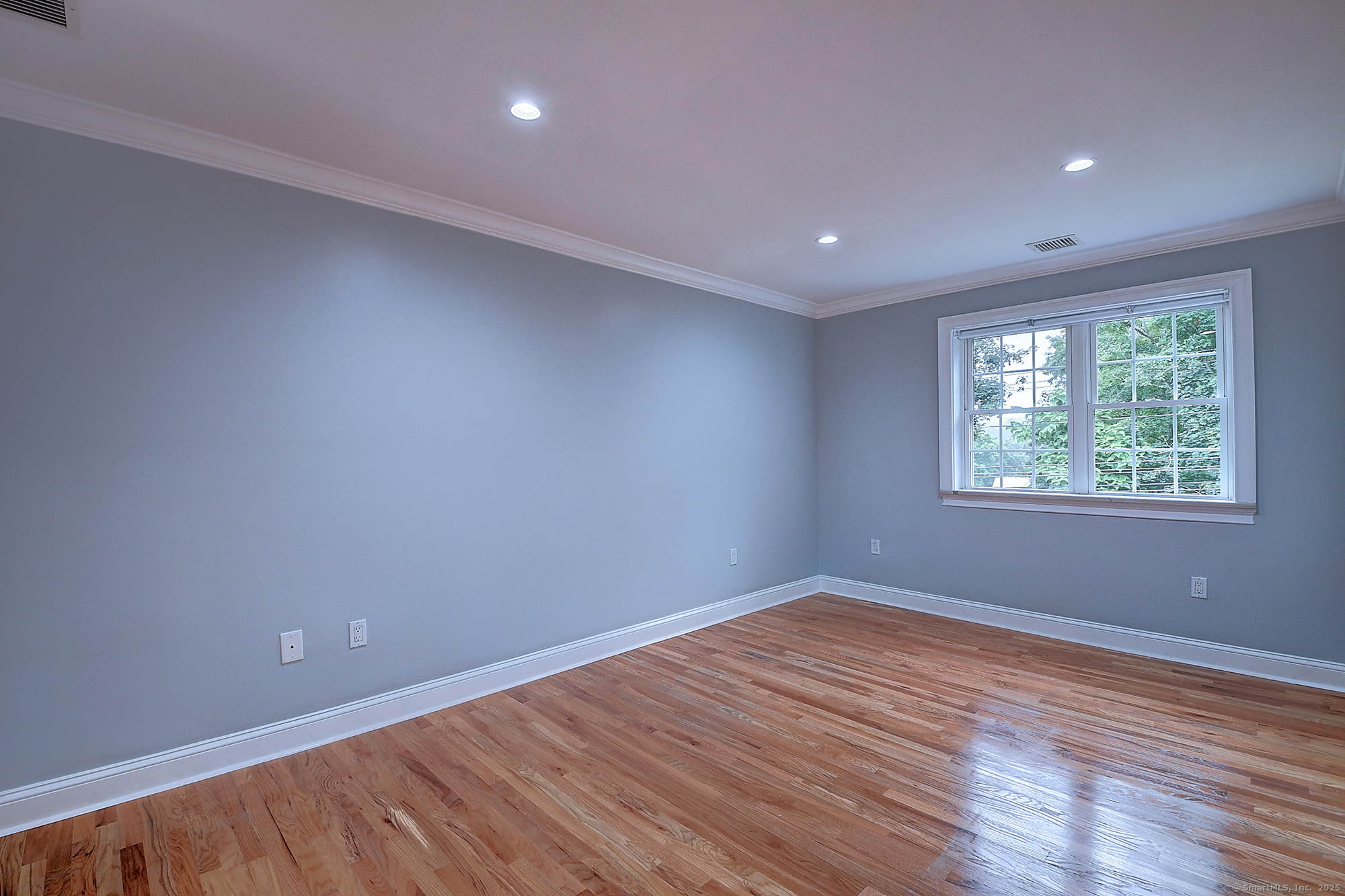 631 High Street Naugatuck, CT 06770 - Photo 22 of 36 a view of an empty room with wooden floor and a window