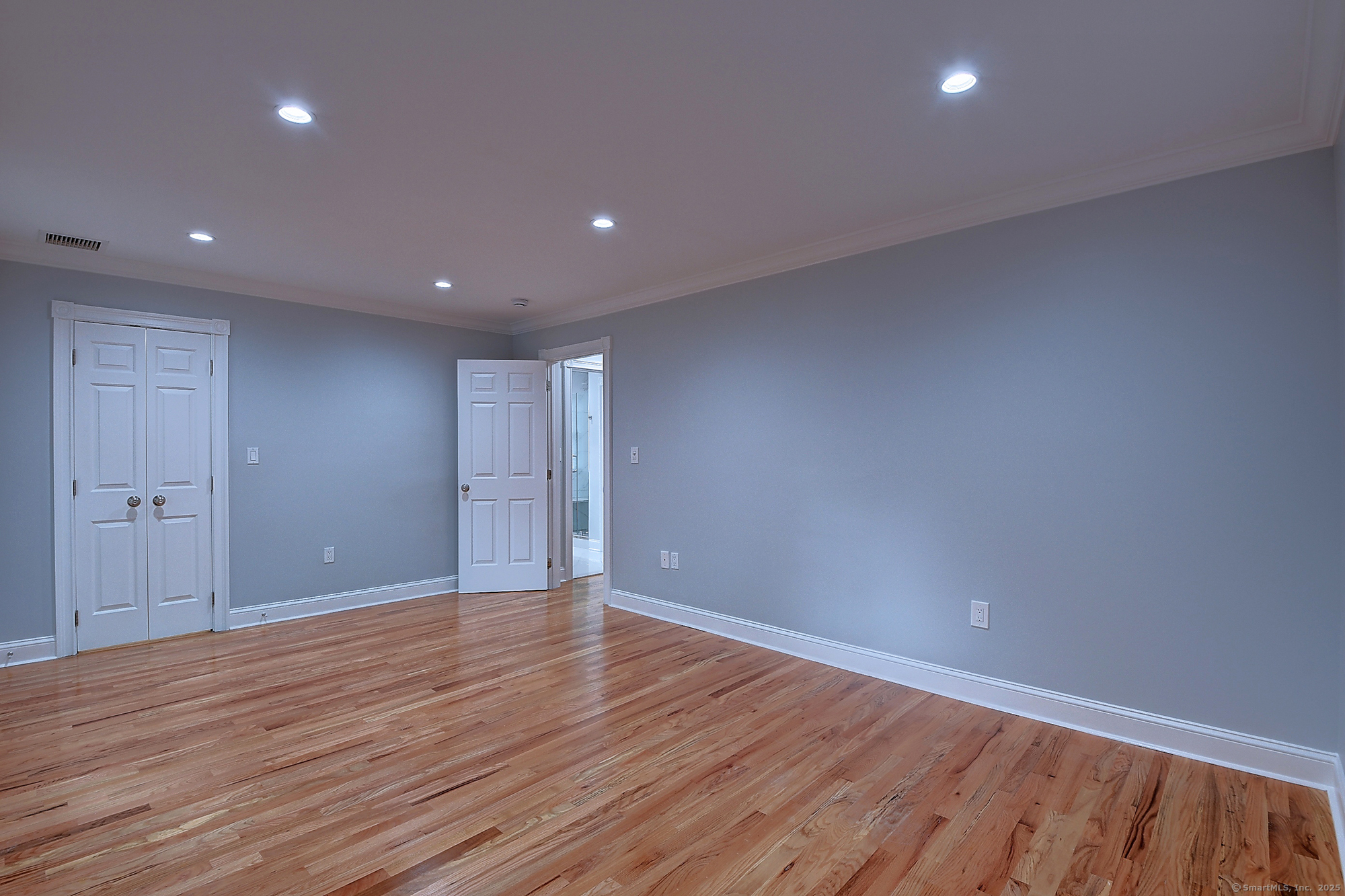 631 High Street Naugatuck, CT 06770 - Photo 24 of 36 a view of an empty room with wooden floor and closet
