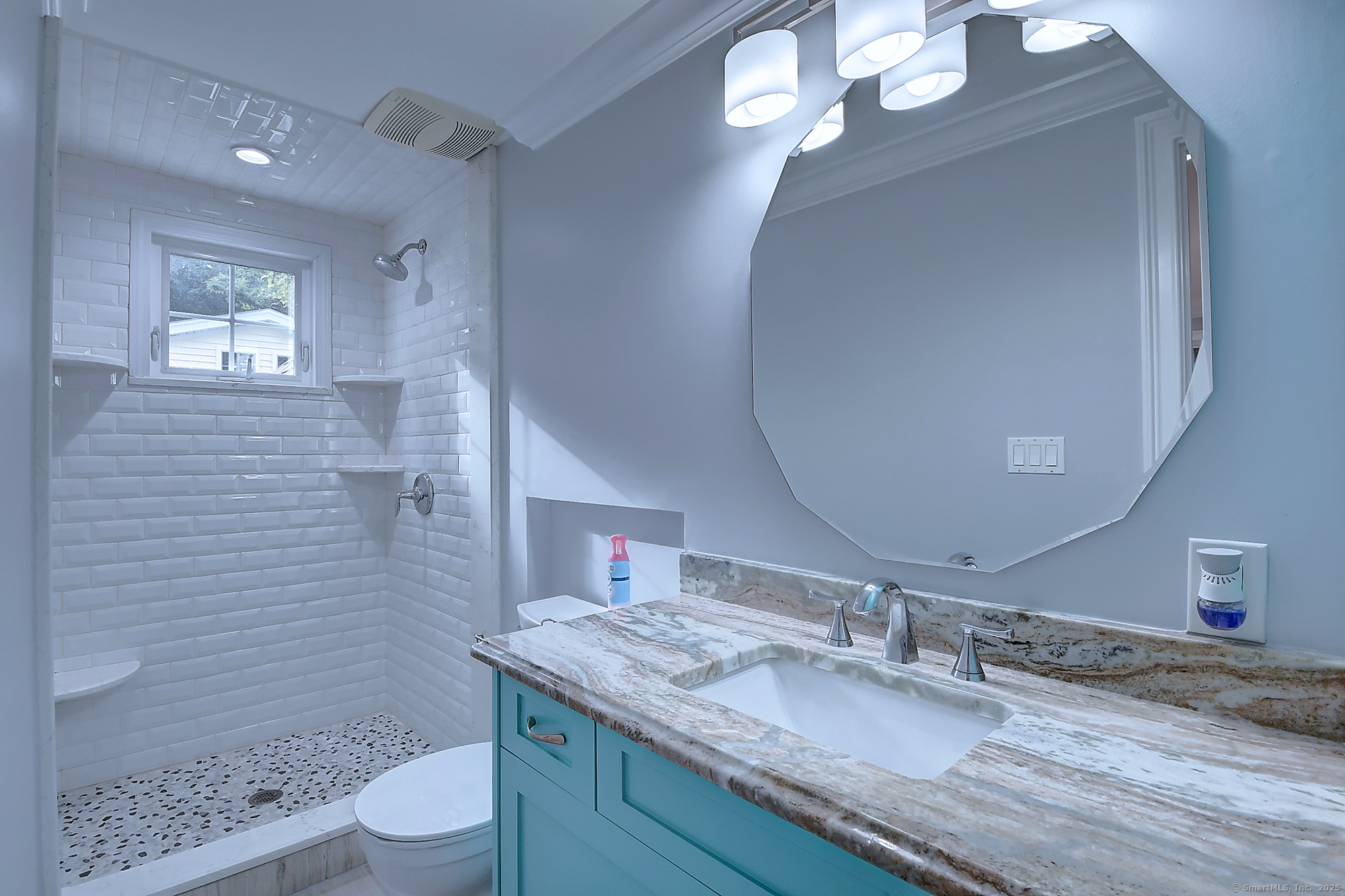 631 High Street Naugatuck, CT 06770 - Photo 28 of 36 a bathroom with a granite countertop sink a toilet a mirror and shower